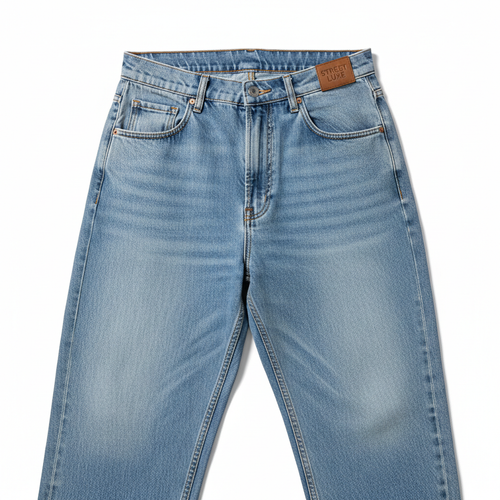 Baggy jeans laid flat on white background